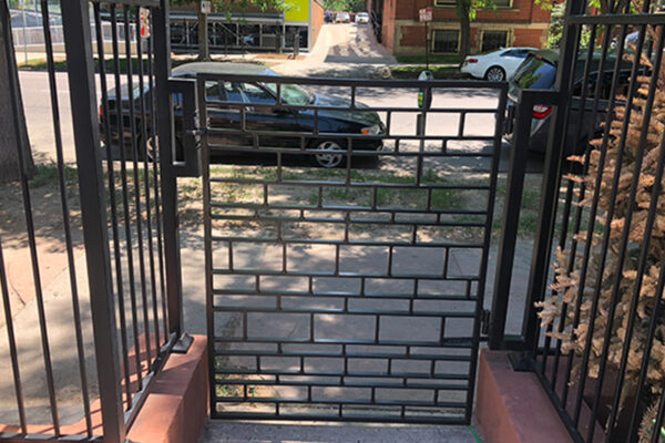 Ornate metal sidewalk gate