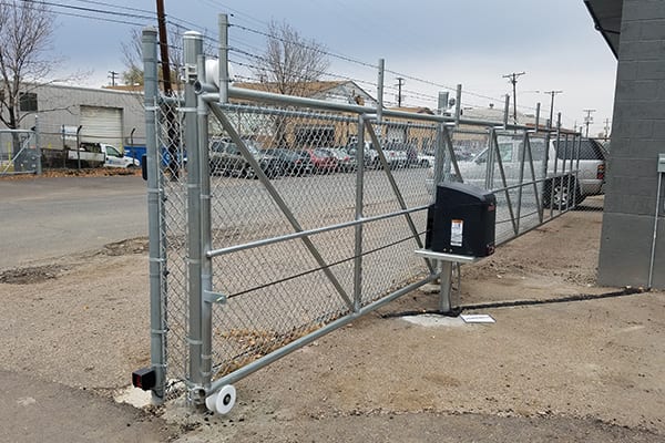 Chain link fence with rolling gate